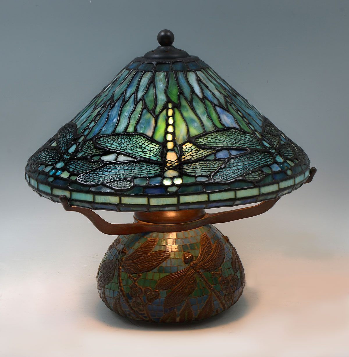 Appraisal: CONTEMPORARY STAINED GLASS DRAGONFLY LAMP Stained glass shade with dragonfly