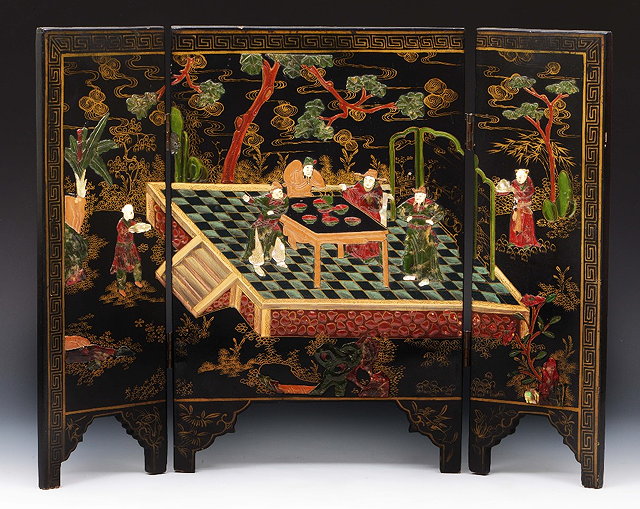 Appraisal: A Chinese black lacquer three fold table screen figures on