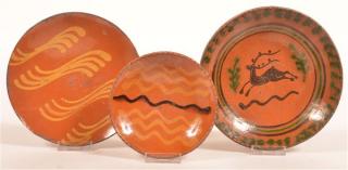 Appraisal: Three Shooner Redware Slip Decorated Plates Three Shooner Redware Pottery