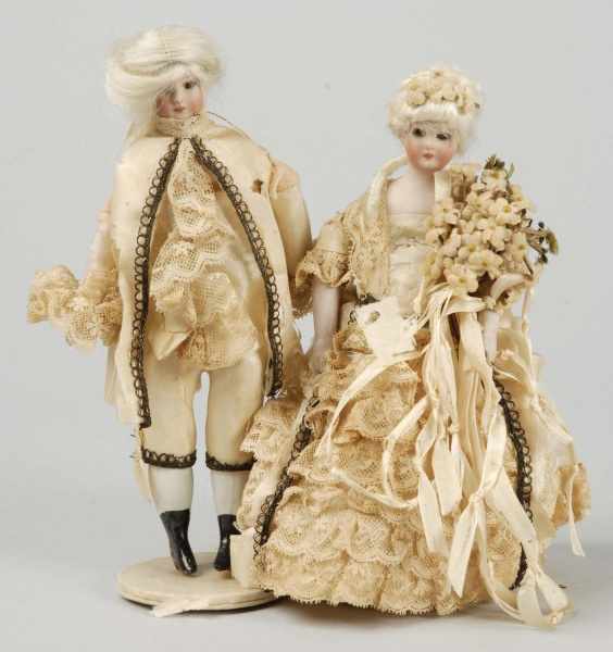 Appraisal: Lovely Pair of German Bisque Doll House Dolls Description Both