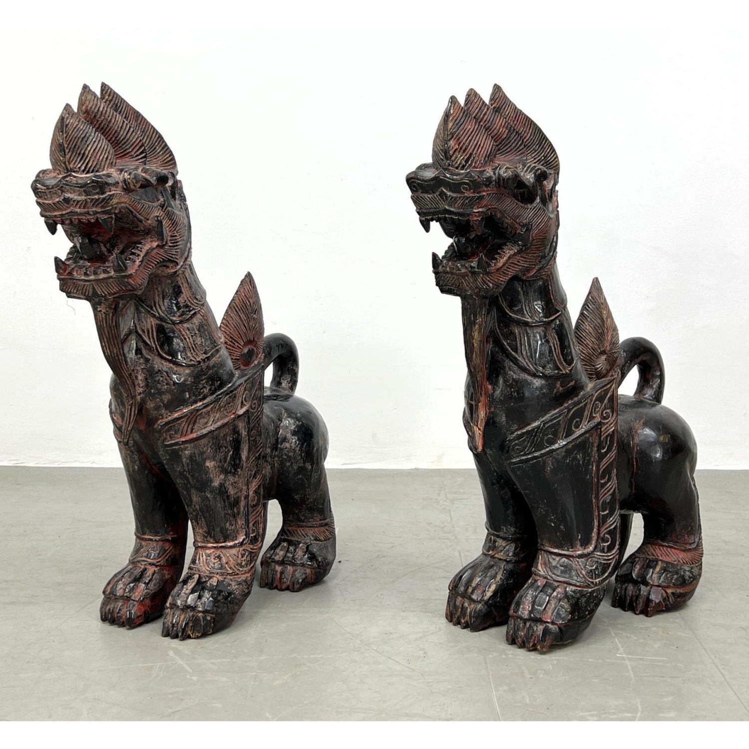 Appraisal: Pr Carved Wood Asian Dragons Guards Figures Black and Red