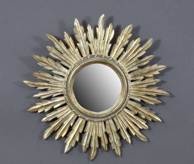 Appraisal: Italian Carved and Silver-Gilt-Finished Wood Sunburst Looking Glass in the