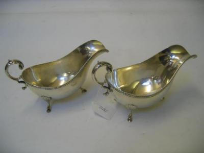 Appraisal: A PAIR OF GRAVY BOATS Birmingham gadrooned rim flying scroll