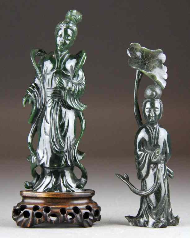 Appraisal: Chinese Qing Carved Jade FiguresFinely carved to depict standing Guanyin