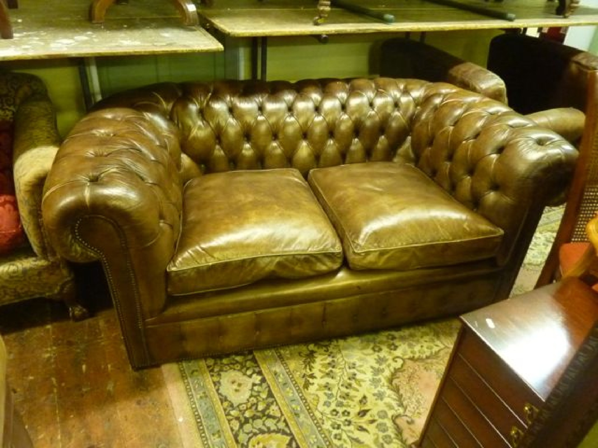 Appraisal: A Victorian style -seat Chesterfield sofa with deep buttoned back