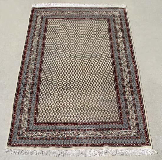 Appraisal: HAND TIED ORIENTAL RUG Repeating geometric pattern ivory ground Approx