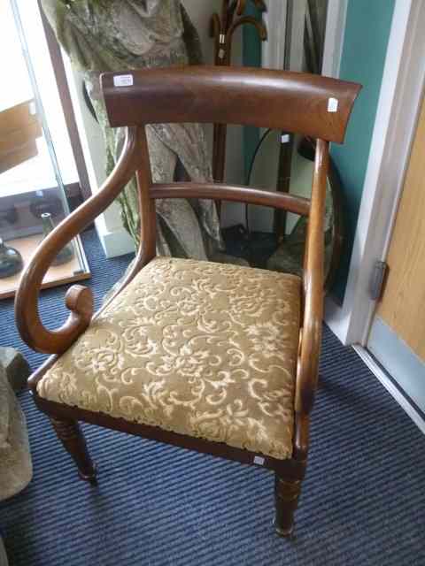 Appraisal: A GEORGIAN MAHOGANY BAR BACK CARVER ARMCHAIR with shepherds crook