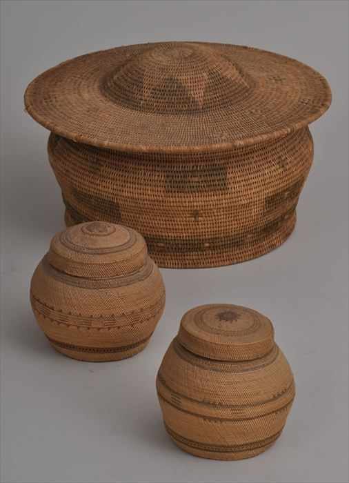 Appraisal: THREE NATIVE AMERICAN BASKETS Comprising a coiled squat spherical box