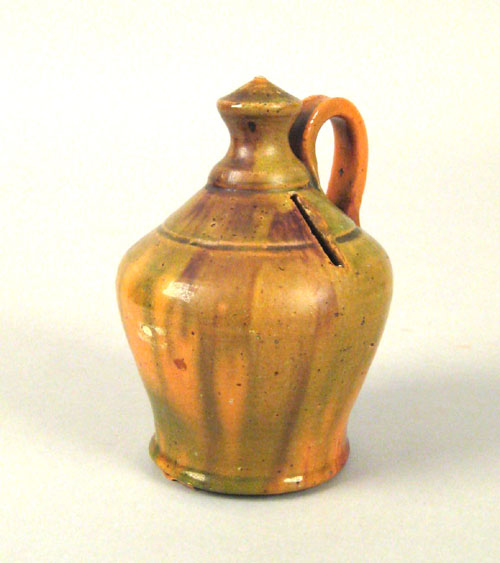 Appraisal: Pennsylvania redware bank late th c with mottled brown orange