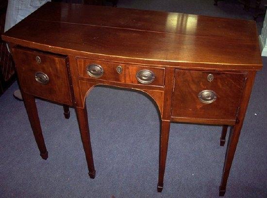 Appraisal: A th Century mahogany bowfront sideboard fitted a short drawer