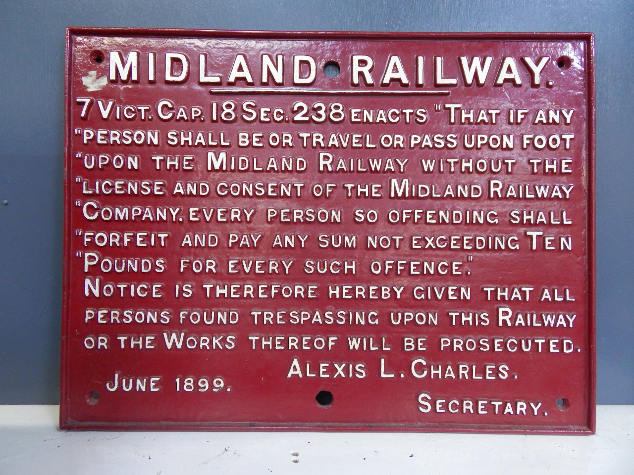 Appraisal: A Midland Railway cast iron sign depicting Trespassing Regulations dated