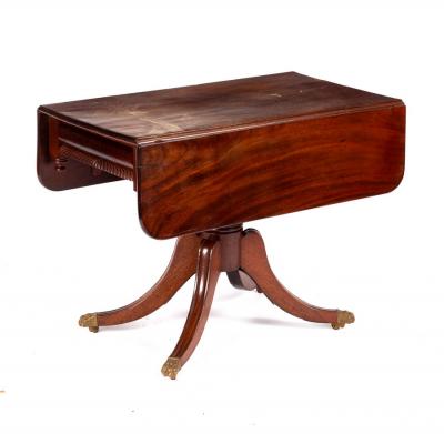 Appraisal: A William IV mahogany two-flap table fitted a drawer with