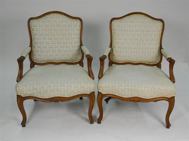 Appraisal: PAIR OF LOUIS XV STYLE CARVED FRUITWOOD FAUTEUIL th century