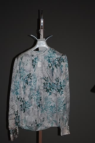 Appraisal: Andr Laug gray green floral print silk long sleeve blouse