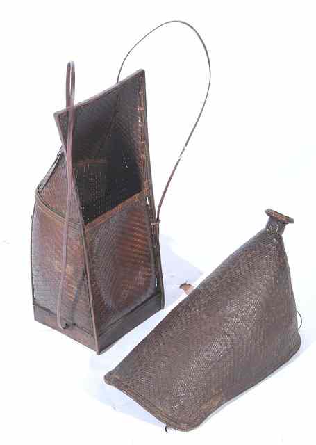 Appraisal: A VIETNAMESE TORSO BASKET with arm straps and rope work