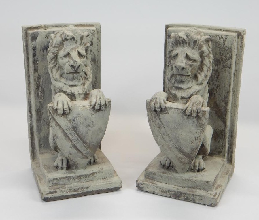 Appraisal: A pair of composition heraldic lion book ends cm high