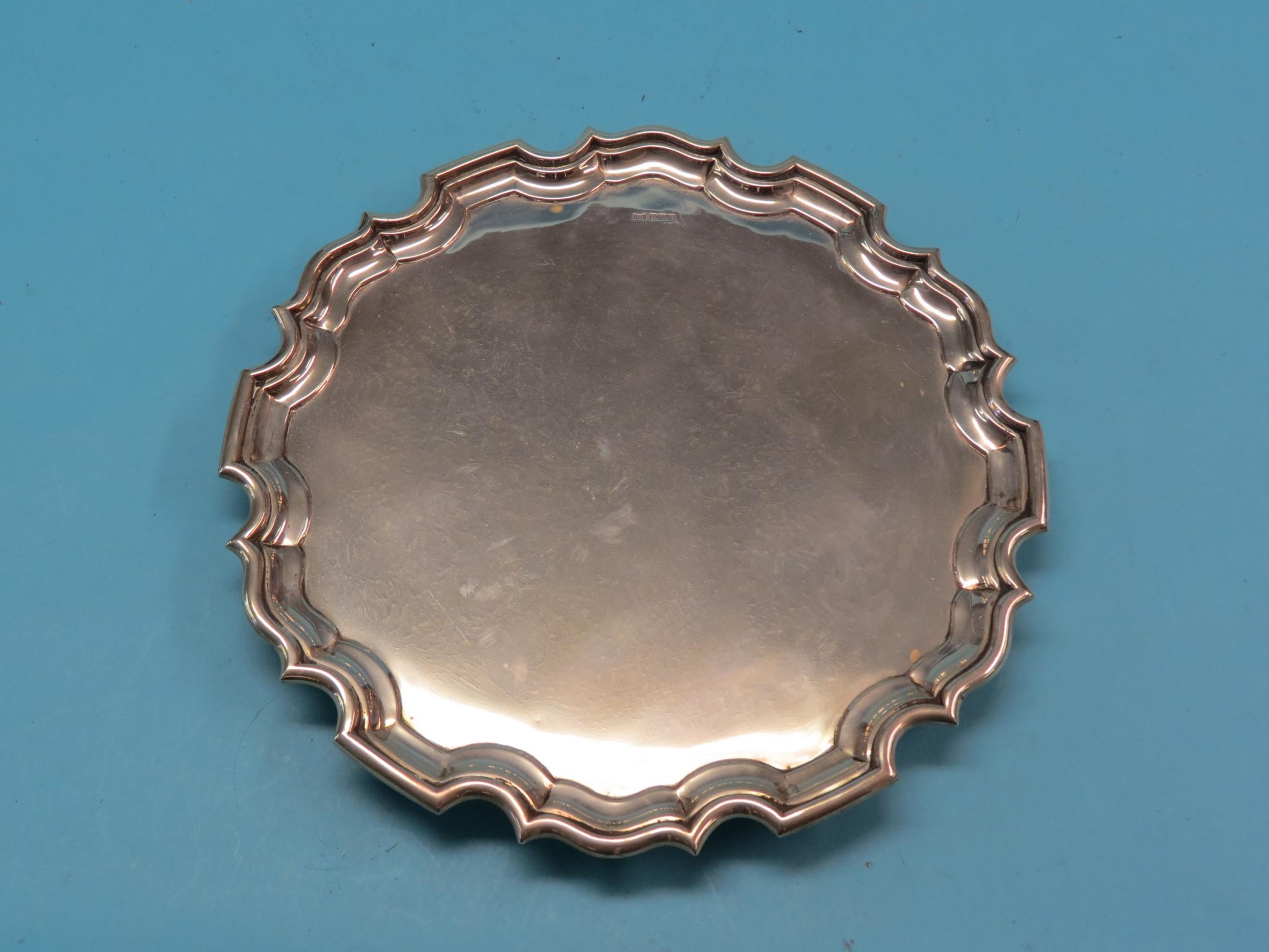 Appraisal: A Walker Hall silver salver circular with scalloped rim on