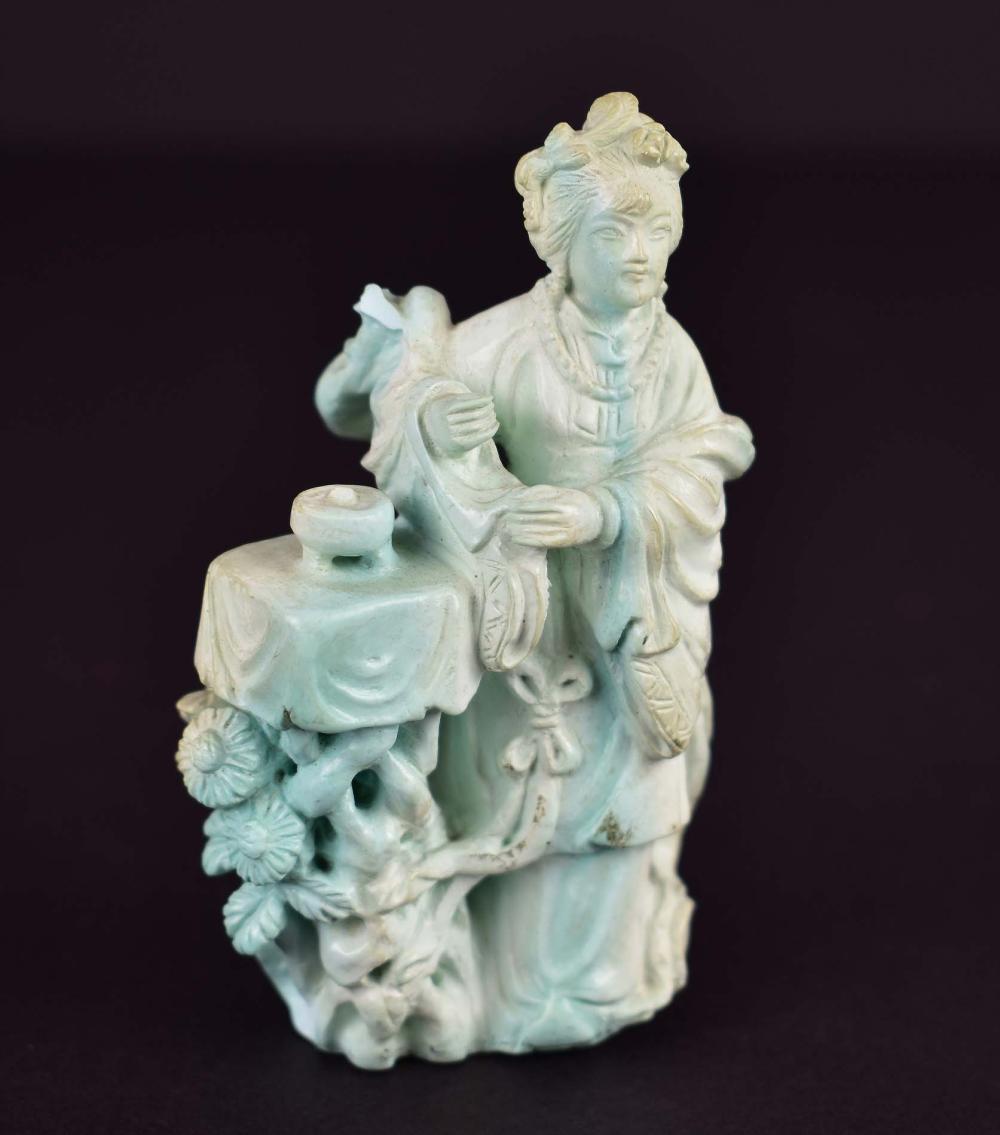 Appraisal: CHINESE CARVED TURQUOISE FEMALE DEITYThe pale blue maiden draped in