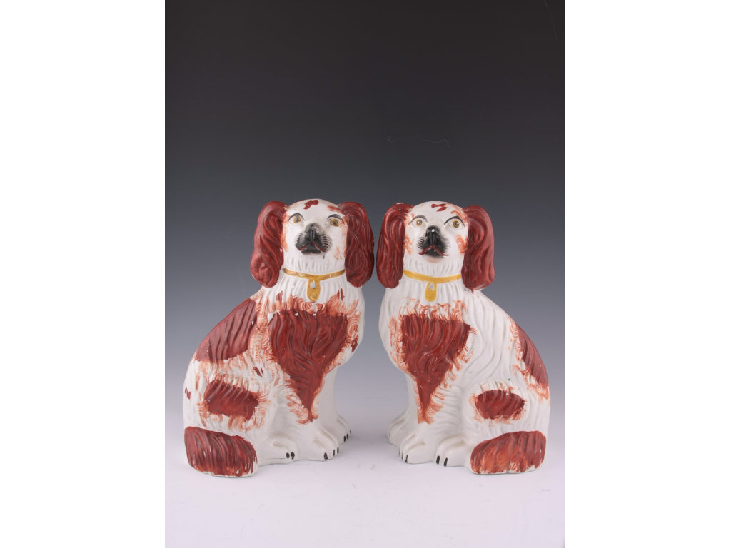 Appraisal: Pair of Staffordshire Comforter Spaniels mantel ornaments second half of