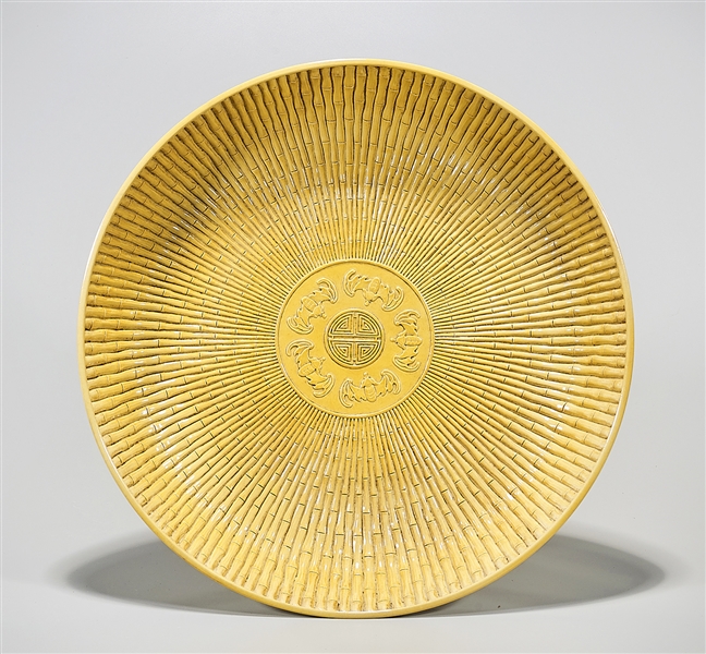 Appraisal: Chinese yellow glazed porcelain charger of bamboo form design D