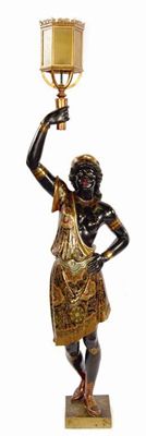 Appraisal: A Venetian carved wood and polychrome decorated blackamoor torchere fitted