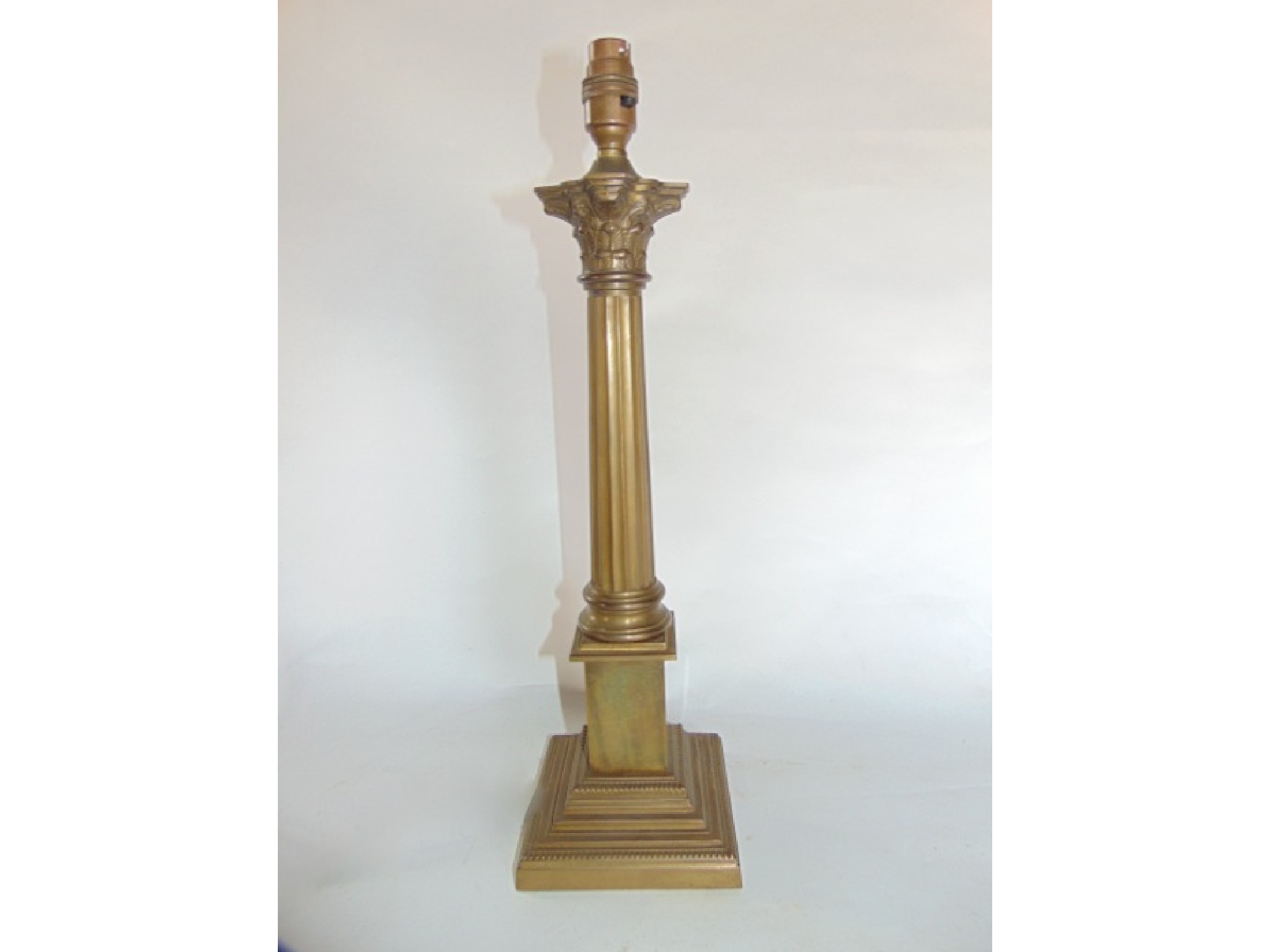 Appraisal: A brass desk lamp in the form of a fluted