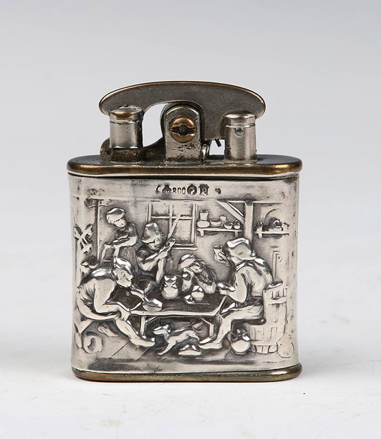 Appraisal: A COLIBRI PATENT LIGHTER with silver outer body with press