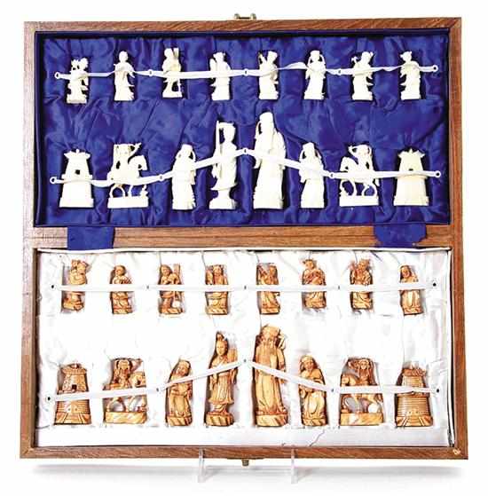 Appraisal: Chinese carved ivory chess set with natural and stained game