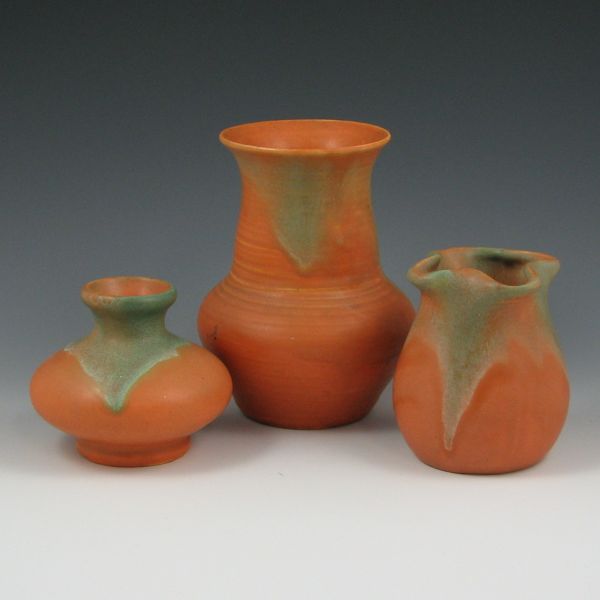 Appraisal: Three Muncie matte green over pumpkin vases Shortest is marked