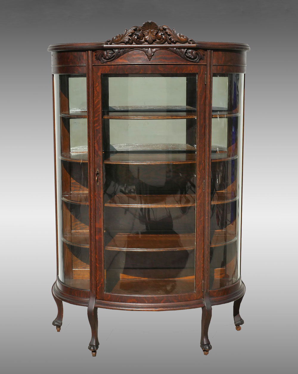 Appraisal: OAK TRIPLE BOW FRONT CABINET Oak Triple bow curio cabinet