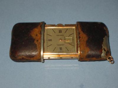 Appraisal: A MOVADO DRESS WATCH TRAVEL CLOCK with silvered oblong dial