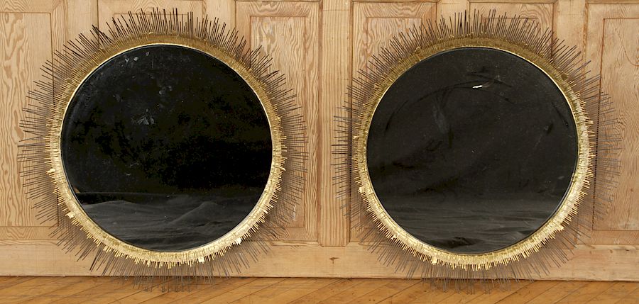 Appraisal: PAIR IRON SUNBURST MIRRORS MANNER LINE VAUTRIN A pair of