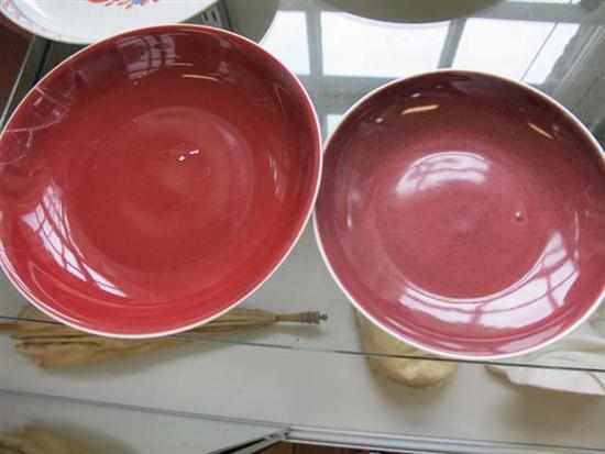 Appraisal: TWO CHINESE OX BLOOD BOWLS ONE ALL FAULTS