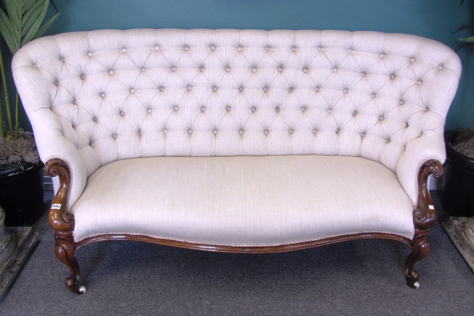 Appraisal: A Victorian mahogany framed button back sofa with serpentine seat