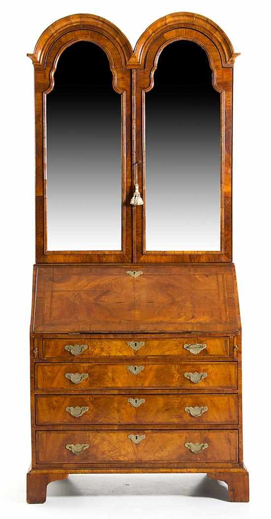 Appraisal: George II style walnut double bonnet secretary bookcase th century