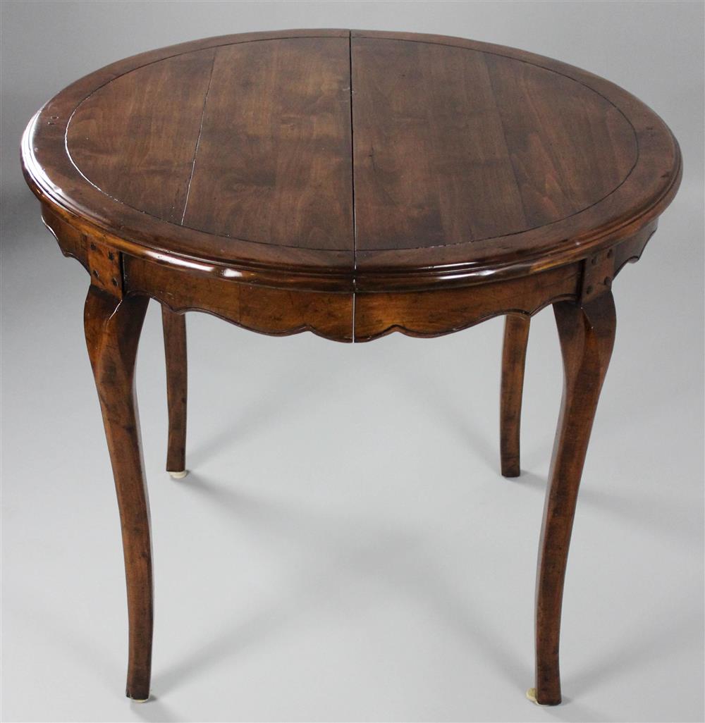 Appraisal: FRENCH PROVINCIAL STYLE CIRCULAR DINING TABLE WITH TWO LEAVES EN