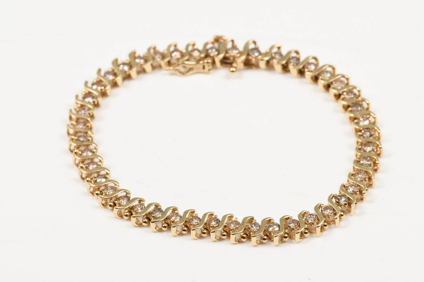 Appraisal: K DIAMOND BRACELET K yellow gold bracelet contains round brilliant