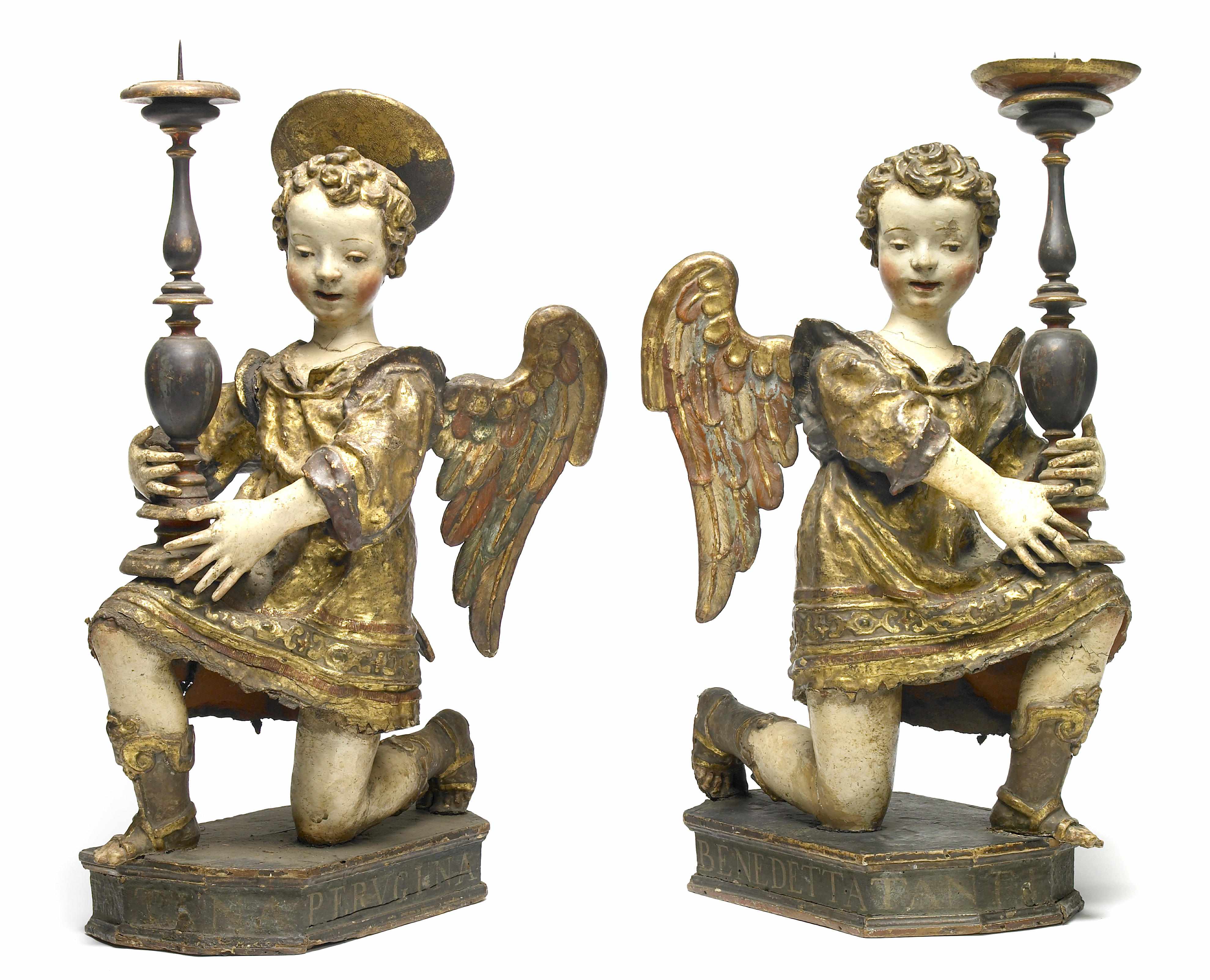 Appraisal: A pair of Italian carved wood and linen covered angel