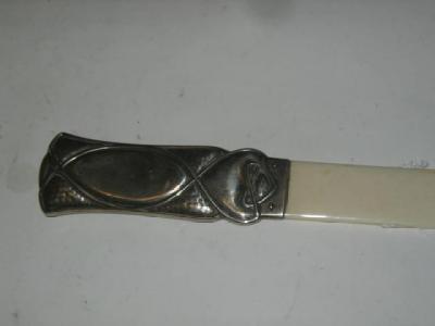 Appraisal: AN ARTS AND CRAFTS PAPER KNIFE Deakin Francis Ltd Birmingham