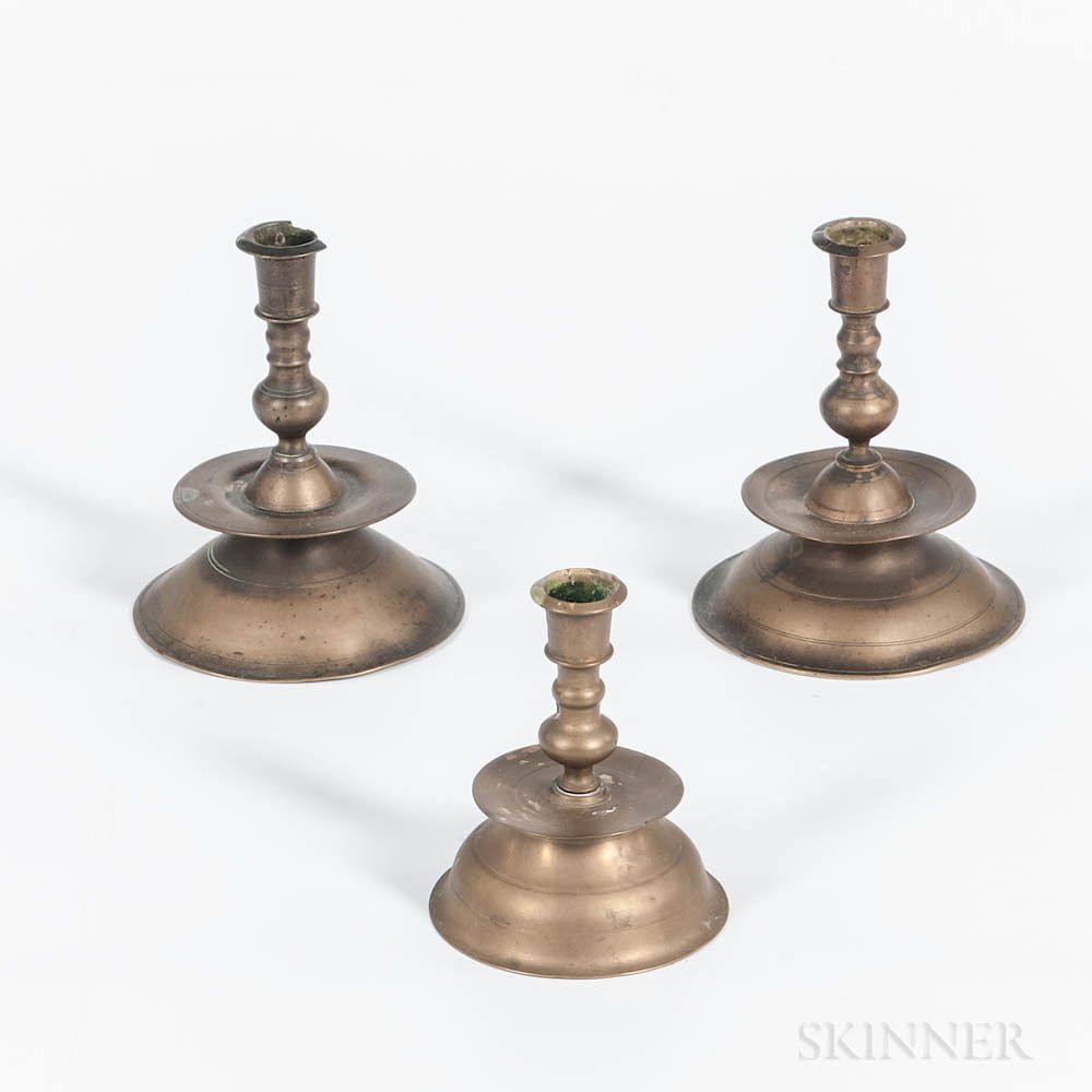 Appraisal: Three Brass Mid-drip Tapersticks Three Brass Mid-drip Tapersticks th century