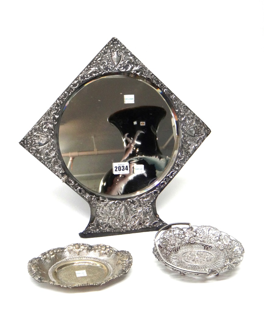 Appraisal: A silver mounted circular mirror having embossed decoration Birmingham an