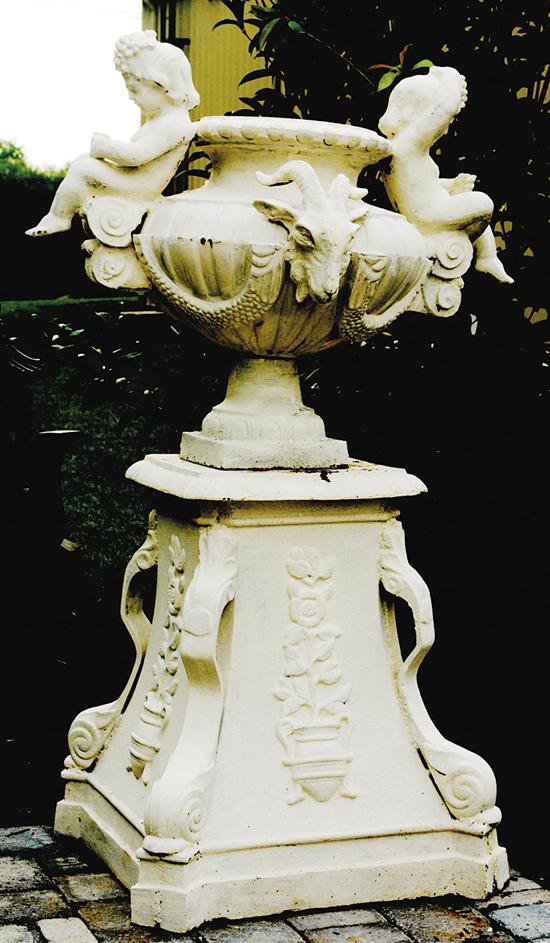 Appraisal: Pair painted cast-iron garden urns on stands flared and lobed