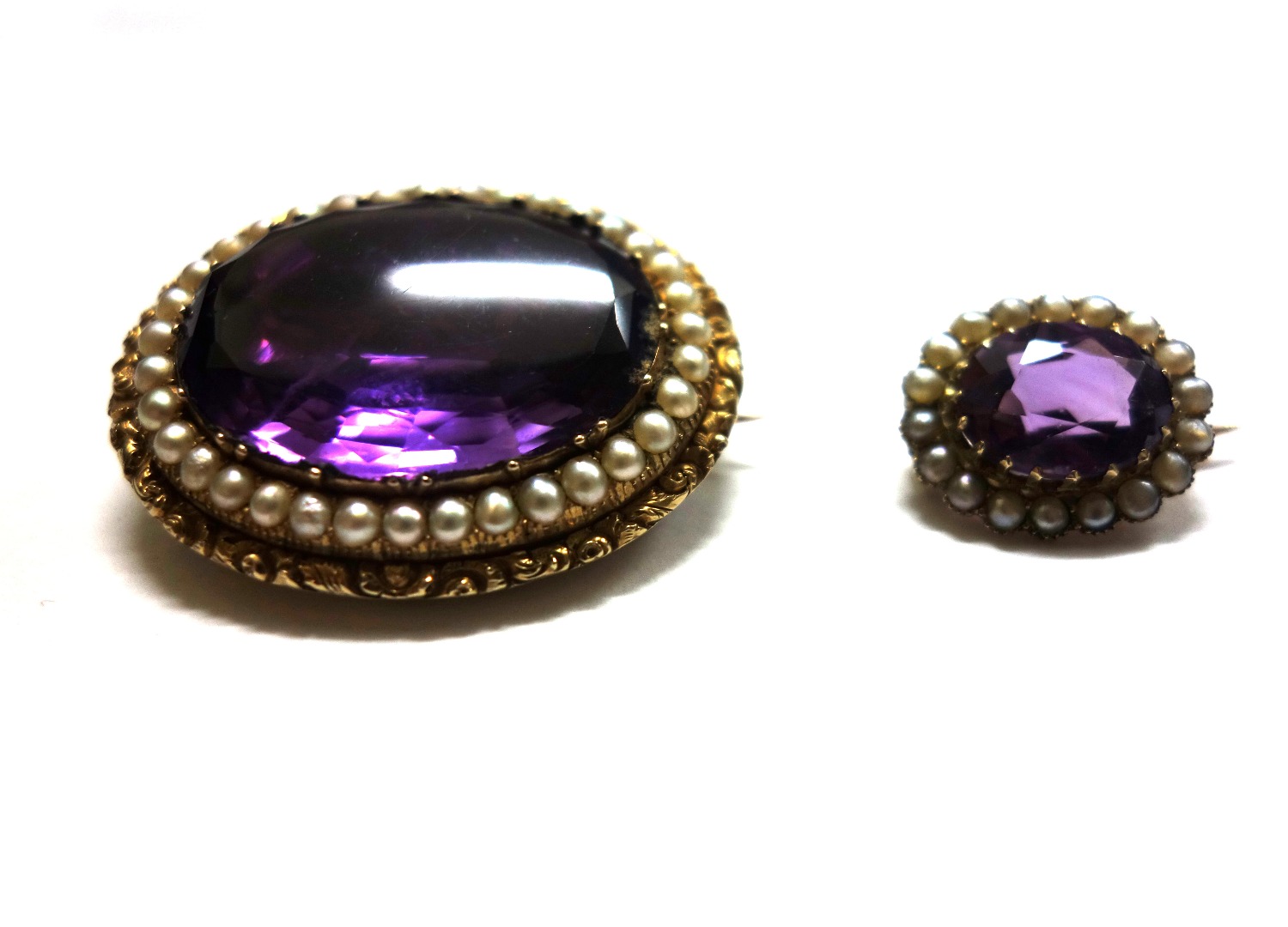 Appraisal: Two late Victorian gold amethyst and half-pearl oval brooches one