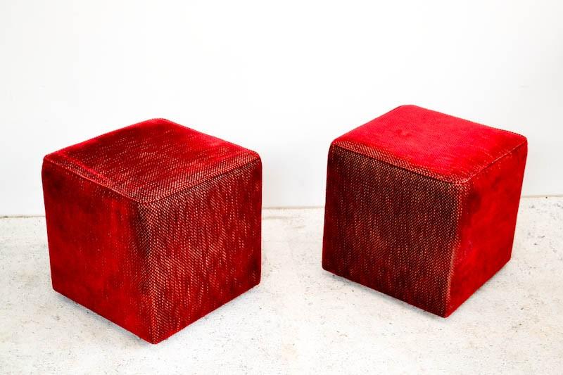 Appraisal: A PAIR OF RED UPHOLSTERED OTTOMANS A PAIR OF RED