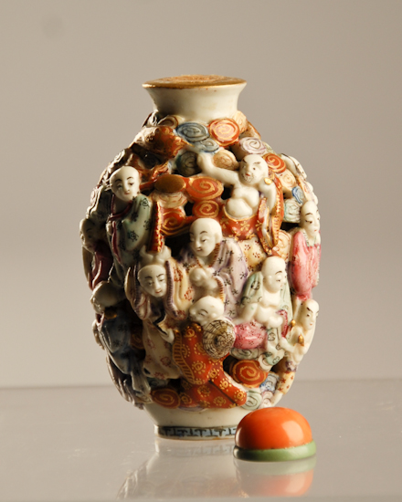 Appraisal: An E th C Porcelain Snuff Bottle with a solid