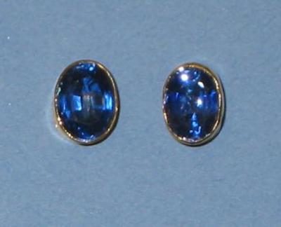 Appraisal: A PAIR OF SAPPHIRE EAR STUDS of oval form collet