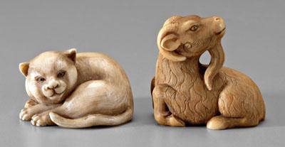 Appraisal: Two Japanese ivory netsukes a very pleasant-looking cat inlaid eyes