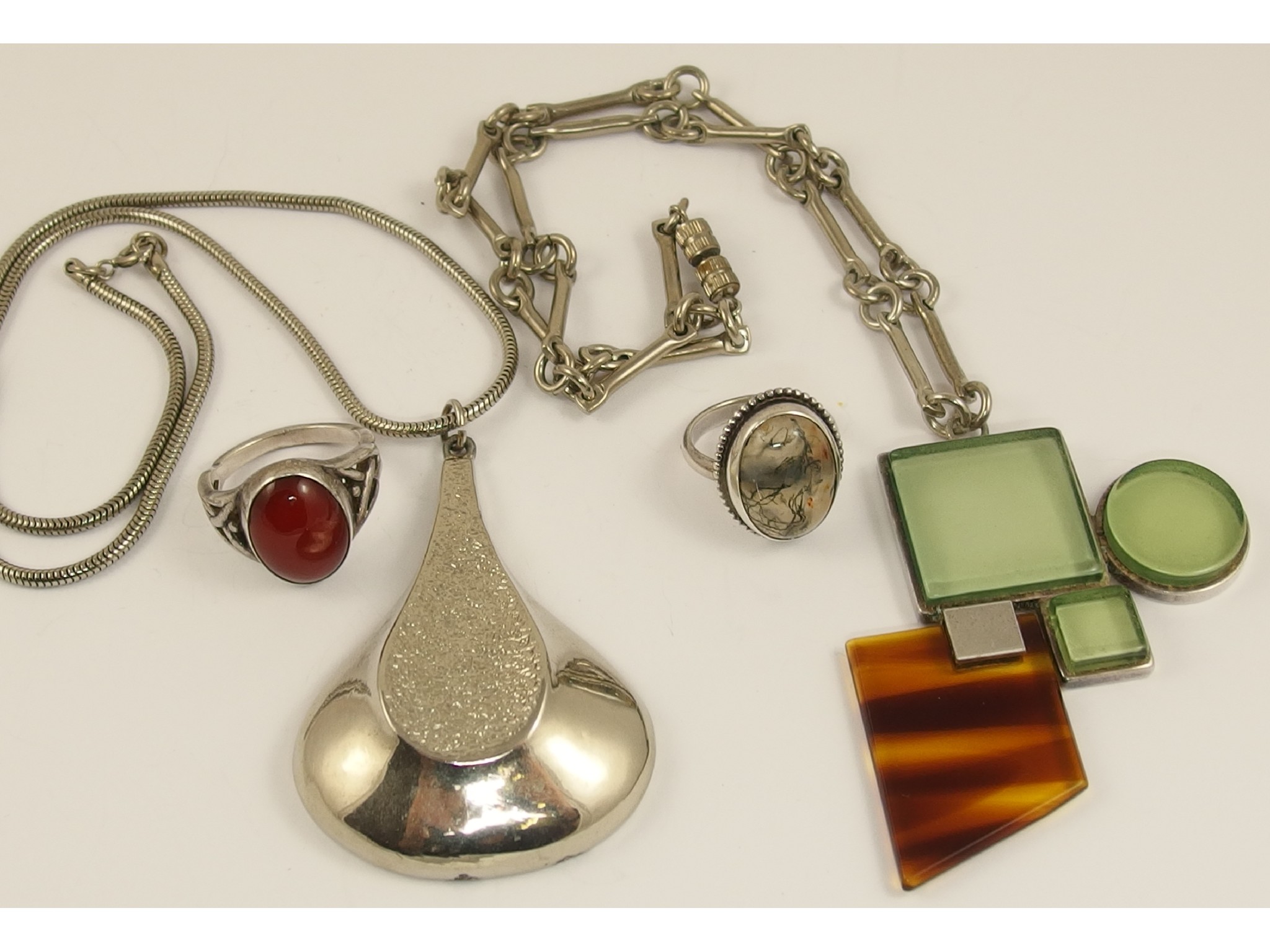 Appraisal: Two retro pendants and two Scottish agate set rings