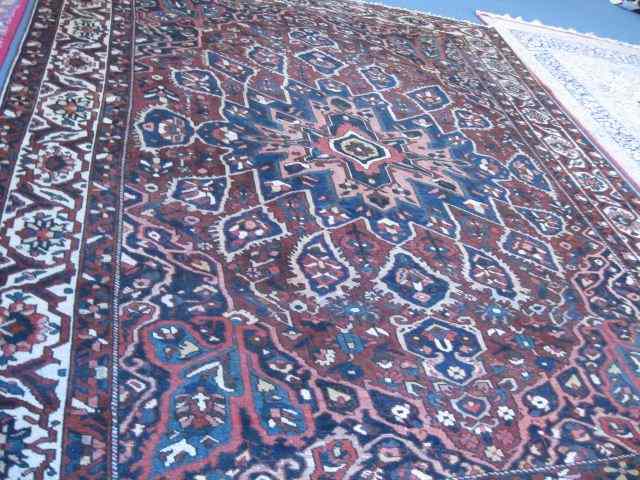 Appraisal: Heriz Persian Handmade Rug room size elaborate central medallion stylized