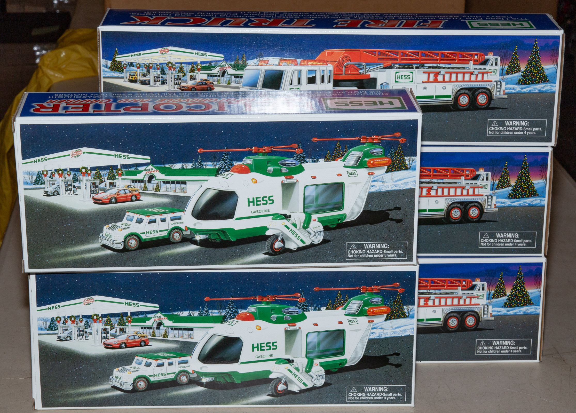 Appraisal: FIVE ASSORTED HESS TRUCKS Includes three and two All mint